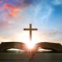 Christian daily devotion concept bible open with cross and morning light