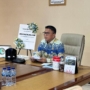 Sekprov Tahlis Gallang saat membuka Forum Koordinasi Pengendalian Mutu Pelayanan Keluarga Berencana (KB) tingkat provinsi, Jumat (21/8/2026).